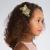 Includes a decorated gold floral hairclip